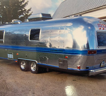 Paul's Airstream Excella in 2000 - new stripes and polish