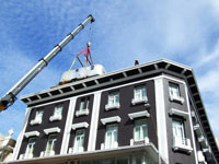 Airstream hoisted to roof of S. Africa Hotel