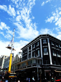 Airstream hoisted to roof of S. Africa Hotel