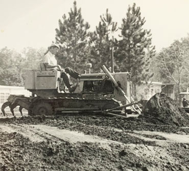 Paul on bulldozer in Florida